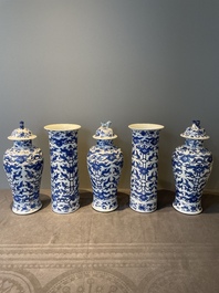 A Chinese blue and white garniture of five vases with lotus scrolls, 19th C.