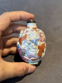 Six Chinese moulded famille rose snuff bottles, Qianlong mark, 19th C.