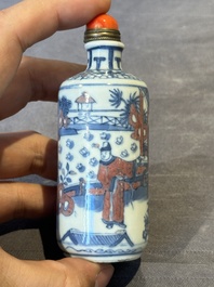 A Chinese blue, white and copper-red snuff bottle, Kangxi mark, 19th C.