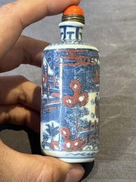 A Chinese blue, white and copper-red snuff bottle, Kangxi mark, 19th C.