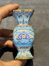A Chinese Canton enamel 'gu' vase with floral design, Qianlong mark and of the period