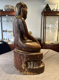 A Burmese lacquered and gilt wooden Buddha, 17/18th C.