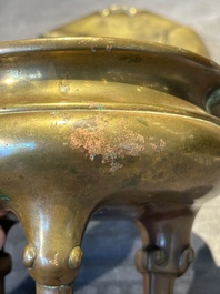 A Chinese bronze tripod censer with cover and stand, 19th C.