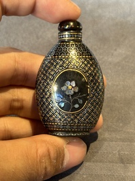 Two Chinese lacquered and mother-of-pearl-inlaid snuff bottles and a carved mother-of-pearl shell snuff bottle, Qianlong mark, 18/19th C