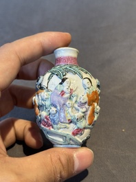 Six Chinese moulded famille rose snuff bottles, Qianlong mark, 19th C.