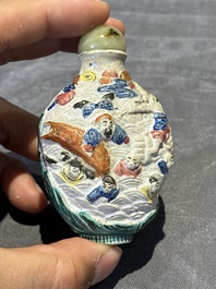 Eight Chinese moulded famille rose snuff bottles, Qianlong mark, 19th C.