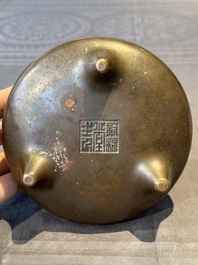 A Chinese bronze tripod censer, Guan Huai Tang Zhu Ren 冠槐堂主人 mark, 17/18th C.
