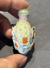 Eight Chinese moulded famille rose snuff bottles, Qianlong mark, 19th C.