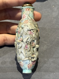 Eight Chinese moulded famille rose snuff bottles, Qianlong mark, 19th C.