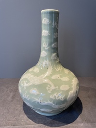 A Chinese celadon-ground slib design 'dragon' vase and Chinese blue and white vase or incense container, 19th C.