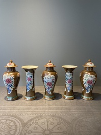A Chinese capucin-brown-ground famille rose garniture of five vases with floral design, Qianlong