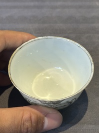A Chinese gilt-decorated grisaille armorial cup and saucer, Qianlong