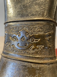 A pair of Chinese bronze 'hu' vases with Taotie design, Song/Yuan
