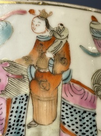 A pair of Chinese famille rose jars and covers with figures in a garden, Tongzhi mark and of the period