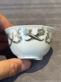A Chinese gilt-decorated grisaille armorial cup and saucer, Qianlong
