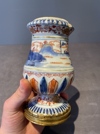 A pair of Chinese Imari-style casters or vases with gilt bronze mounts, Kangxi