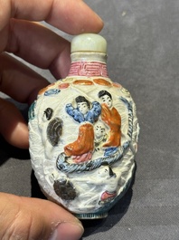 Eight Chinese moulded famille rose snuff bottles, Qianlong mark, 19th C.