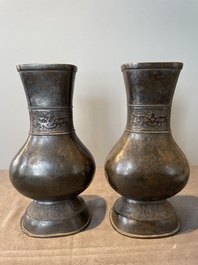 A pair of Chinese bronze 'hu' vases with Taotie design, Song/Yuan