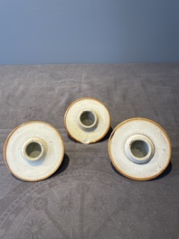 A Chinese capucin-brown-ground famille rose garniture of five vases with floral design, Qianlong
