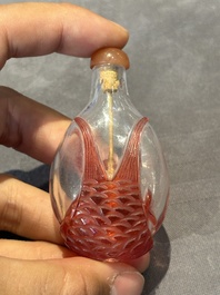 A group of seven Chinese red-overlay glass and red glass snuff bottles, 19/20th C.