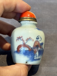 A Chinese blue, white and copper-red snuff bottle, 19th C.