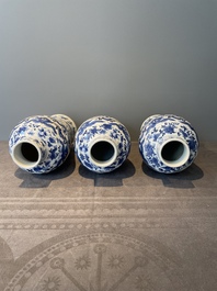A Chinese blue and white garniture of five vases with lotus scrolls, 19th C.