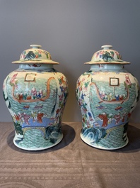 A pair of Chinese famille rose 'hundred boys' vases and covers on wooden stands, 19th C.