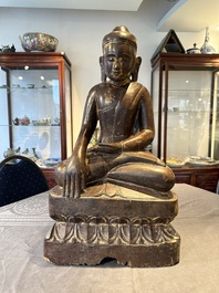 A Burmese lacquered and gilt wooden Buddha, 17/18th C.