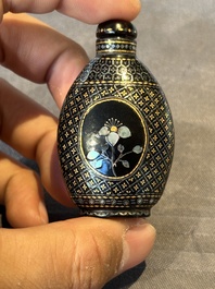 Two Chinese lacquered and mother-of-pearl-inlaid snuff bottles and a carved mother-of-pearl shell snuff bottle, Qianlong mark, 18/19th C