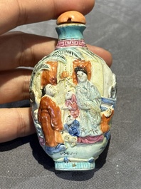 Eight Chinese moulded famille rose snuff bottles, Qianlong mark, 19th C.