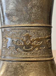 A pair of Chinese bronze 'hu' vases with Taotie design, Song/Yuan