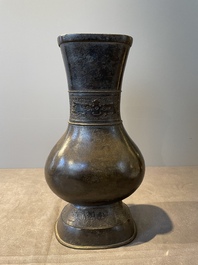 A pair of Chinese bronze 'hu' vases with Taotie design, Song/Yuan
