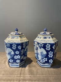 A pair of Chinese blue and white hexagonal jars and covers with a lady holding a fan, 19th C.