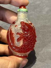 A group of seven Chinese red-overlay glass and red glass snuff bottles, 19/20th C.