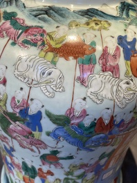 A pair of Chinese famille rose 'hundred boys' vases and covers on wooden stands, 19th C.