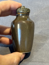 A rare Chinese monochrome teadust-glazed snuff bottle with a bronze 'dragon' stopper, 18/19th C.