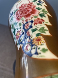 A Chinese capucin-brown-ground famille rose garniture of five vases with floral design, Qianlong