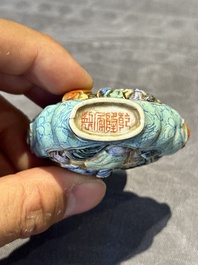 Eight Chinese moulded famille rose snuff bottles, Qianlong mark, 19th C.