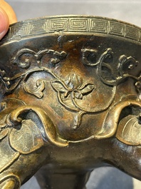 A fine Chinese tripod 'elephant' censer and cover, Ming