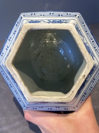 A pair of Chinese blue and white hexagonal jars and covers with a lady holding a fan, 19th C.