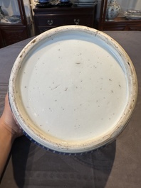 A Chinese blue and white 'flower scroll' jar with a wooden cover, Qianlong