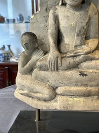 A Burmese limestone stele with Buddha and two attendants with traces of gilding, 19th C.