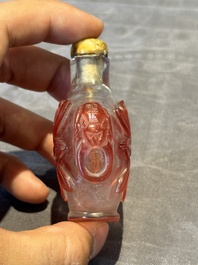 A group of six Chinese overlay glass snuff bottles, 19th C.