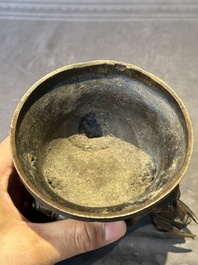 A fine Chinese tripod 'elephant' censer and cover, Ming