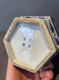 A pair of Chinese blue and white hexagonal jars and covers with a lady holding a fan, 19th C.