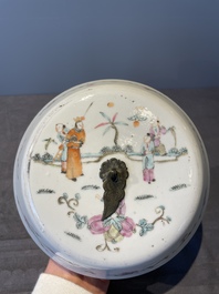A pair of Chinese famille rose jars and covers with figures in a garden, Tongzhi mark and of the period