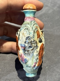 Eight Chinese moulded famille rose snuff bottles, Qianlong mark, 19th C.