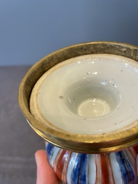 A pair of Chinese Imari-style casters or vases with gilt bronze mounts, Kangxi