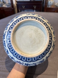 A Chinese blue and white 'lotus scroll' bottle vase, 18/19th C.