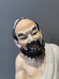 A Chinese polychrome sculpture of a lumberjack, Jingdezheng mark, 20th C.